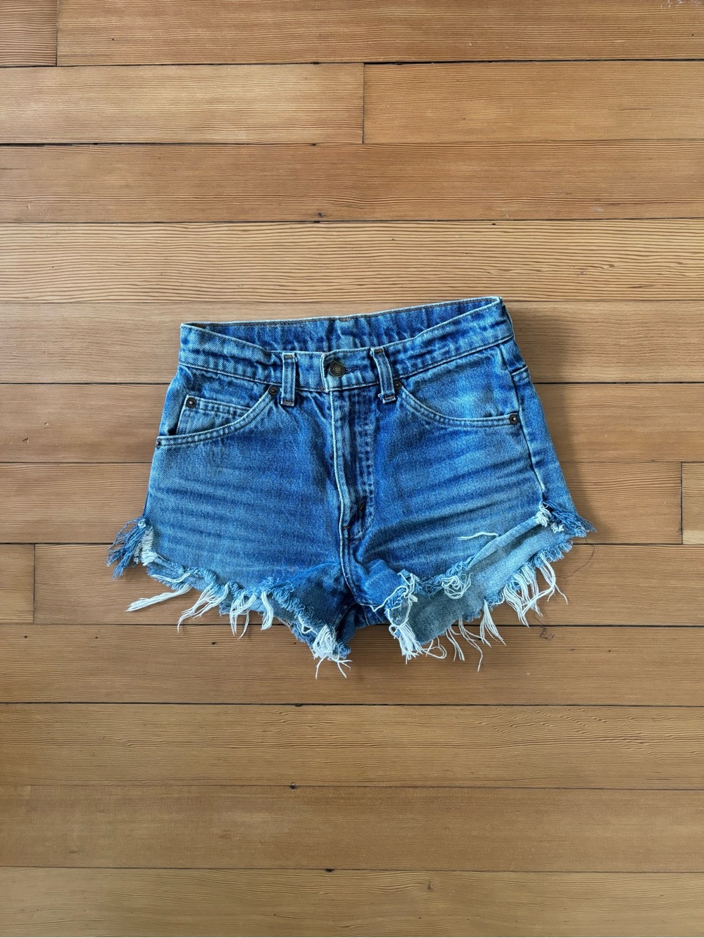 Vintage Levi’s 550 Daisy Duke cut offs made in Belgium 90s orange tab
